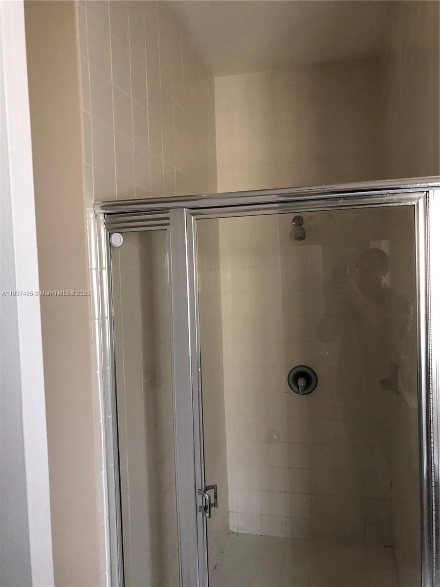 13426 Southwest 177th Terrace Miami, FL 33177 - Photo 28 of 36 a bathroom with a shower