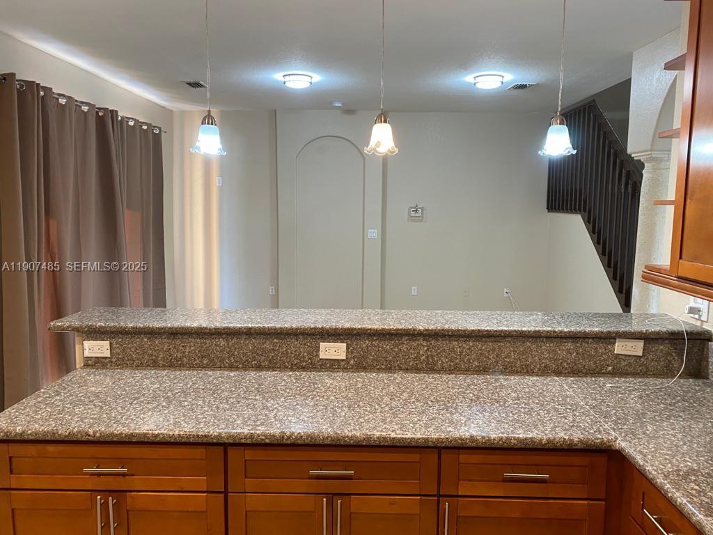 13426 Southwest 177th Terrace Miami, FL 33177 - Photo 10 of 36 a bathroom with a sink and a mirror