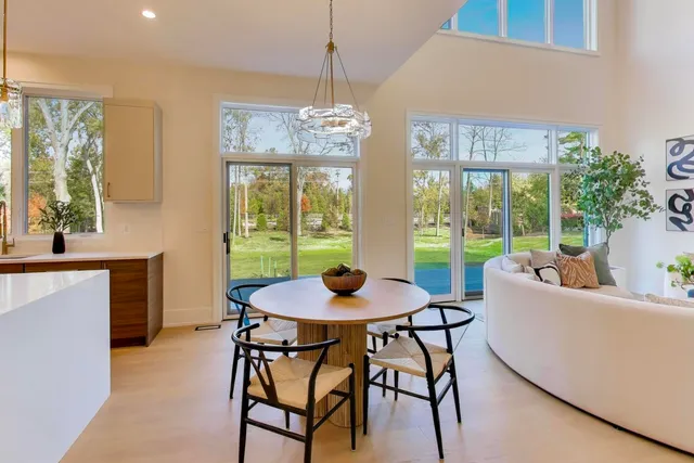 an empty room with window and an entryway