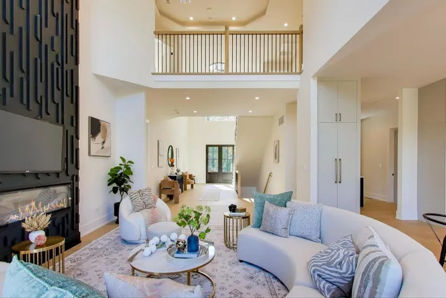 a view of an empty room with a cabinet and a window