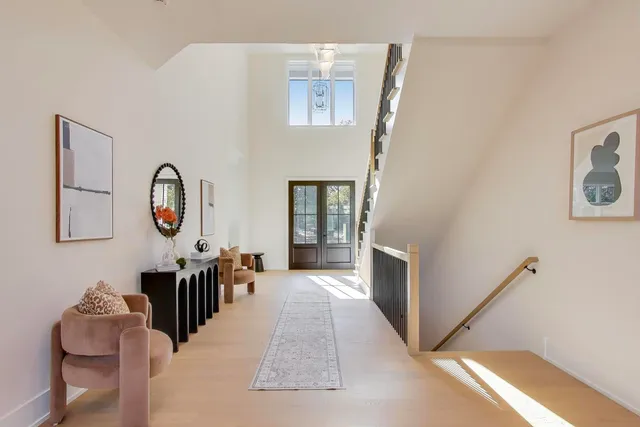 a bedroom with a bed and a potted plant