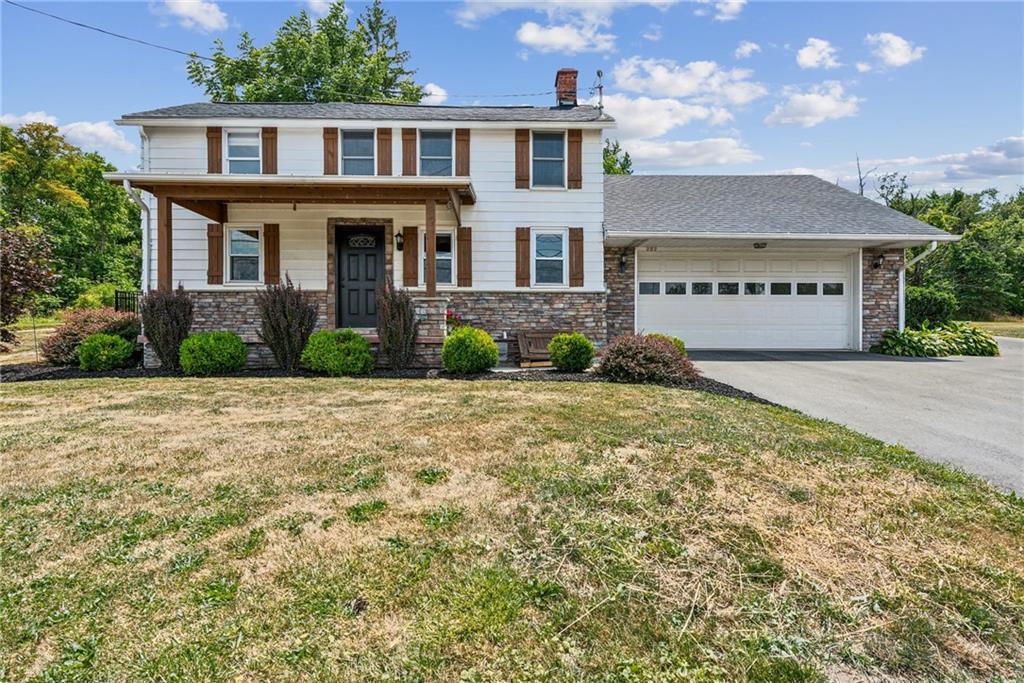 202 Highway 981 Belle Vernon, PA 15012 - Photo 1 of 31 a front view of a house with a yard and a garage