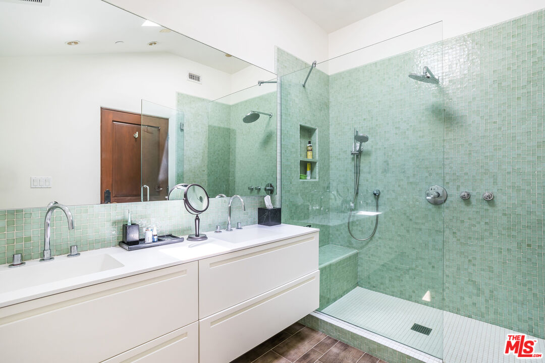 604 Alta Drive Beverly Hills, CA 90210 - Photo 13 of 21 a bathroom with a sink shower and a mirror
