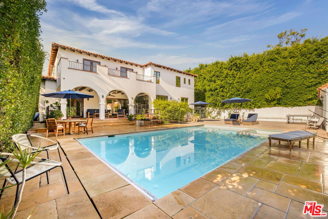 604 Alta Drive Beverly Hills, CA 90210 - Photo 17 of 21 a view of a swimming pool with a patio