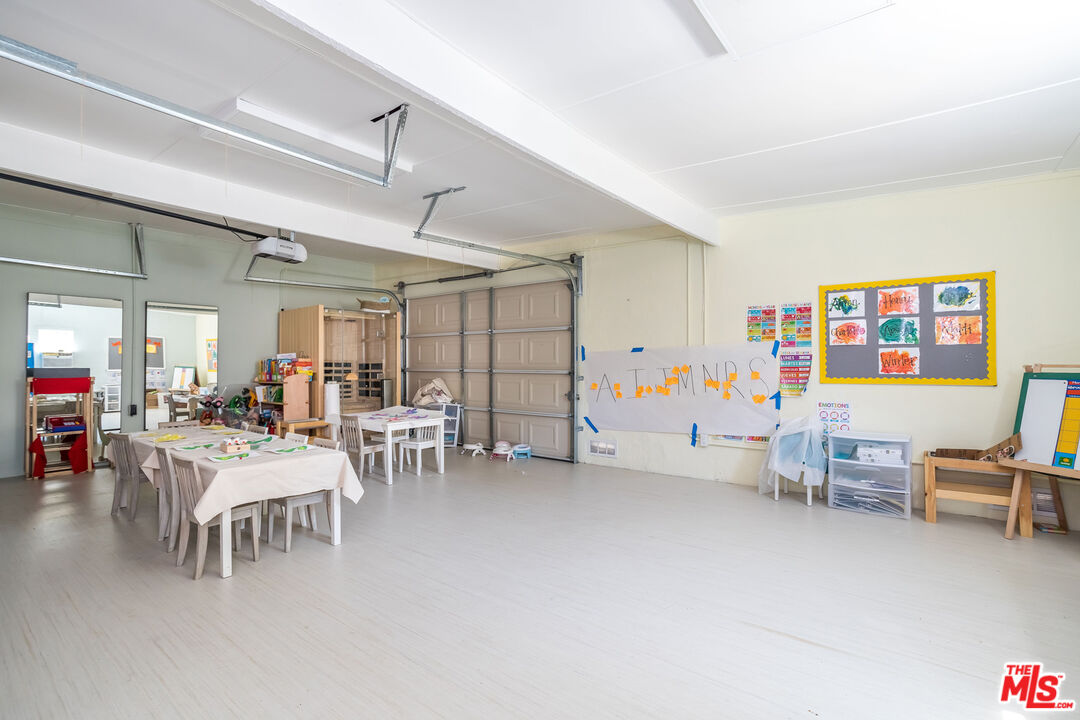 604 Alta Drive Beverly Hills, CA 90210 - Photo 18 of 21 a living room with furniture and a large window