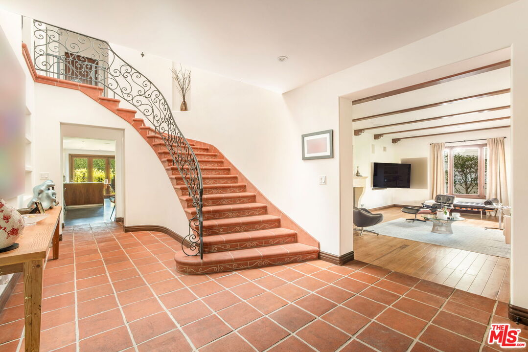 604 Alta Drive Beverly Hills, CA 90210 - Photo 3 of 21 a view of a livingroom with furniture and staircase