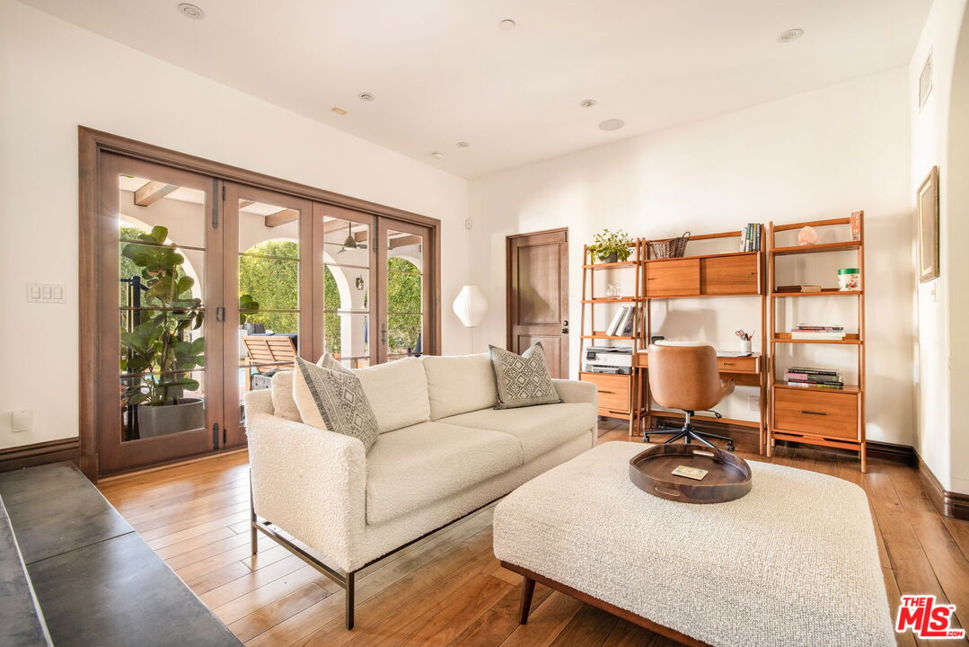 604 Alta Drive Beverly Hills, CA 90210 - Photo 8 of 21 a living room with furniture and a flat screen tv