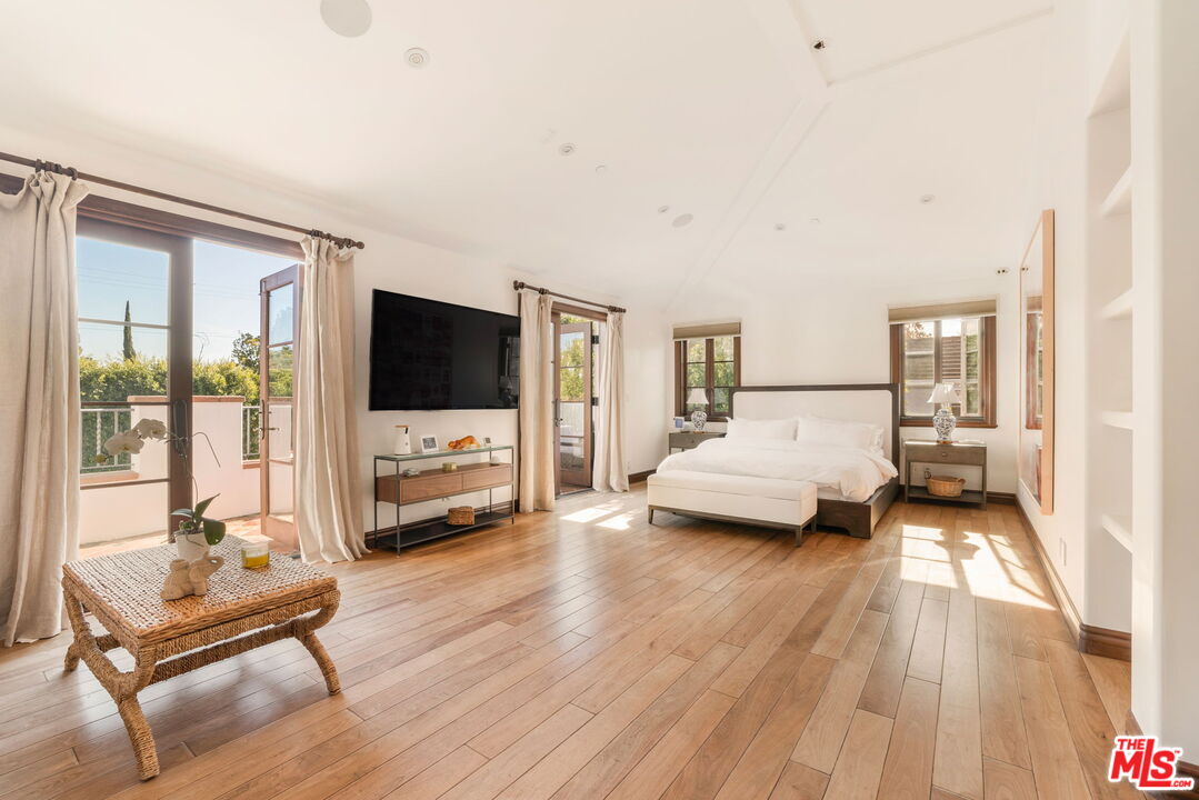 604 Alta Drive Beverly Hills, CA 90210 - Photo 9 of 21 a living room with furniture and a flat screen tv