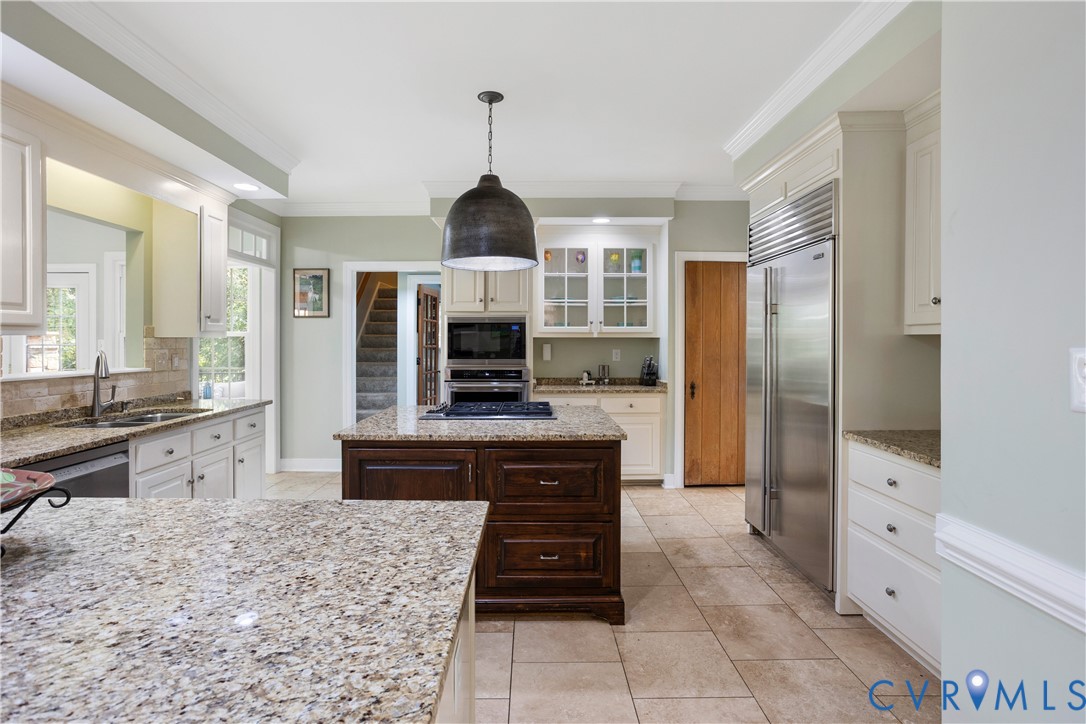 407 Lynchell Place Henrico, VA 23238 - Photo 18 of 50 a kitchen with stainless steel appliances kitchen island granite countertop a refrigerator and a stove