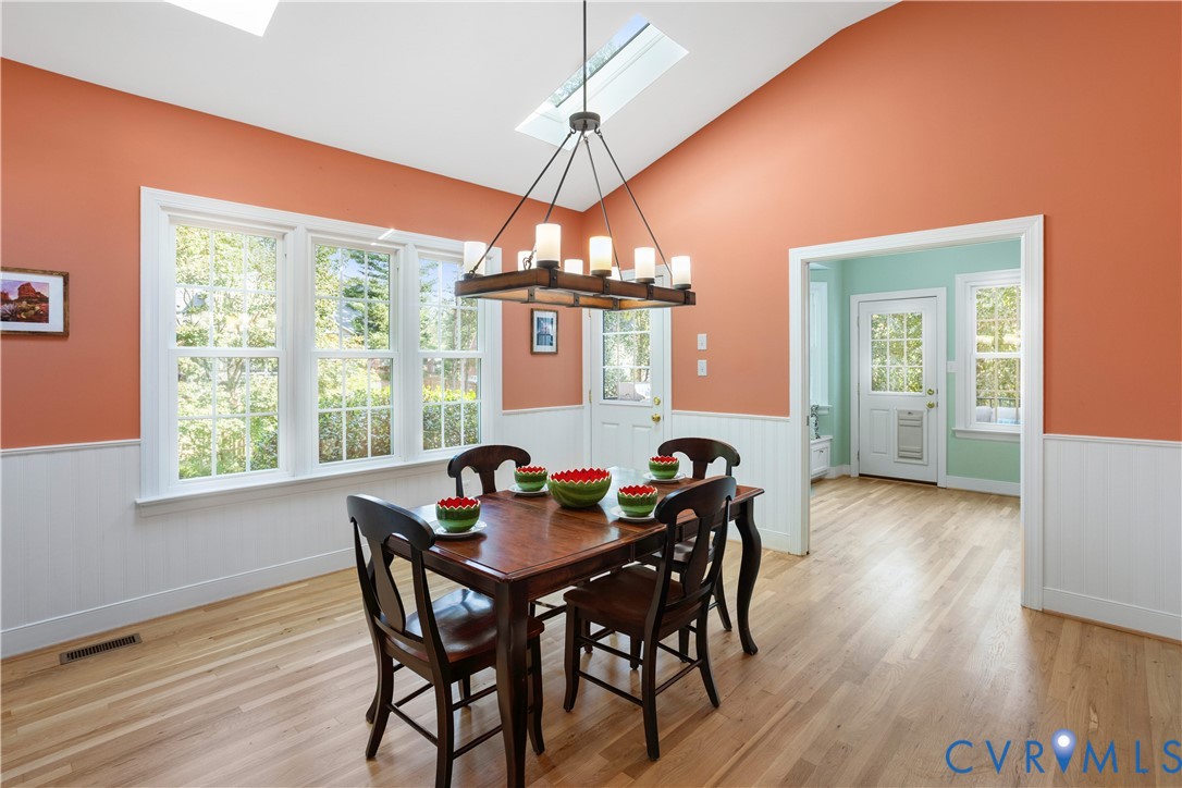 407 Lynchell Place Henrico, VA 23238 - Photo 21 of 50 a view of a dining room with furniture window and wooden floor