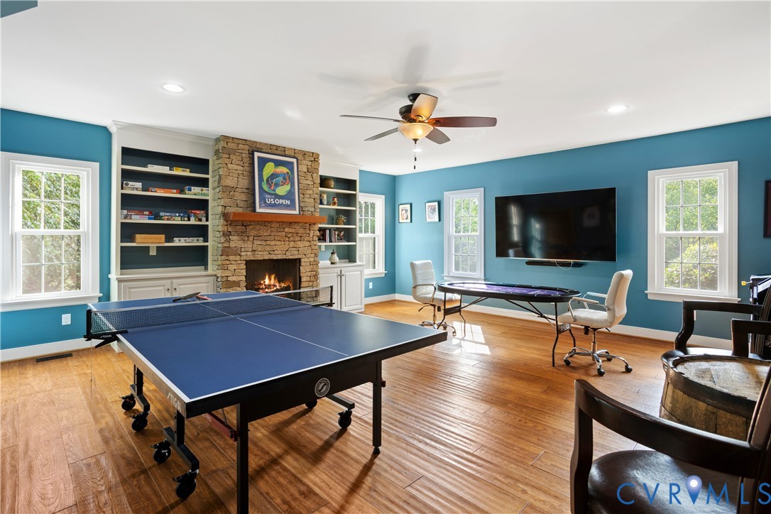 407 Lynchell Place Henrico, VA 23238 - Photo 24 of 50 a living room with furniture a flat screen tv and a fireplace