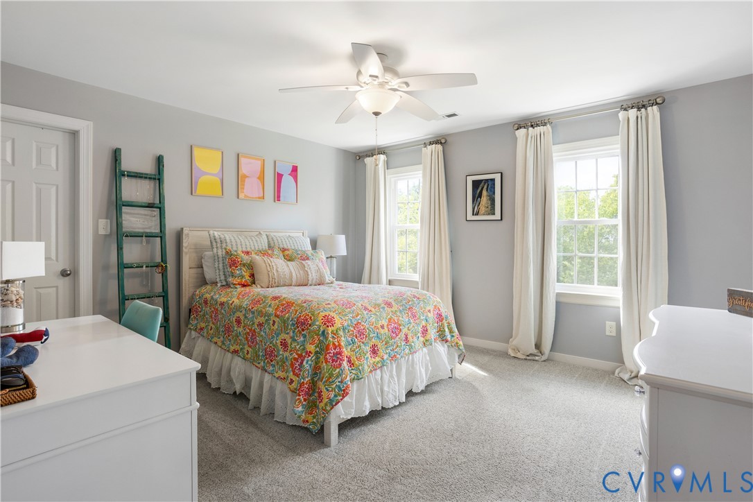 407 Lynchell Place Henrico, VA 23238 - Photo 34 of 50 a bedroom with a bed and a chandelier