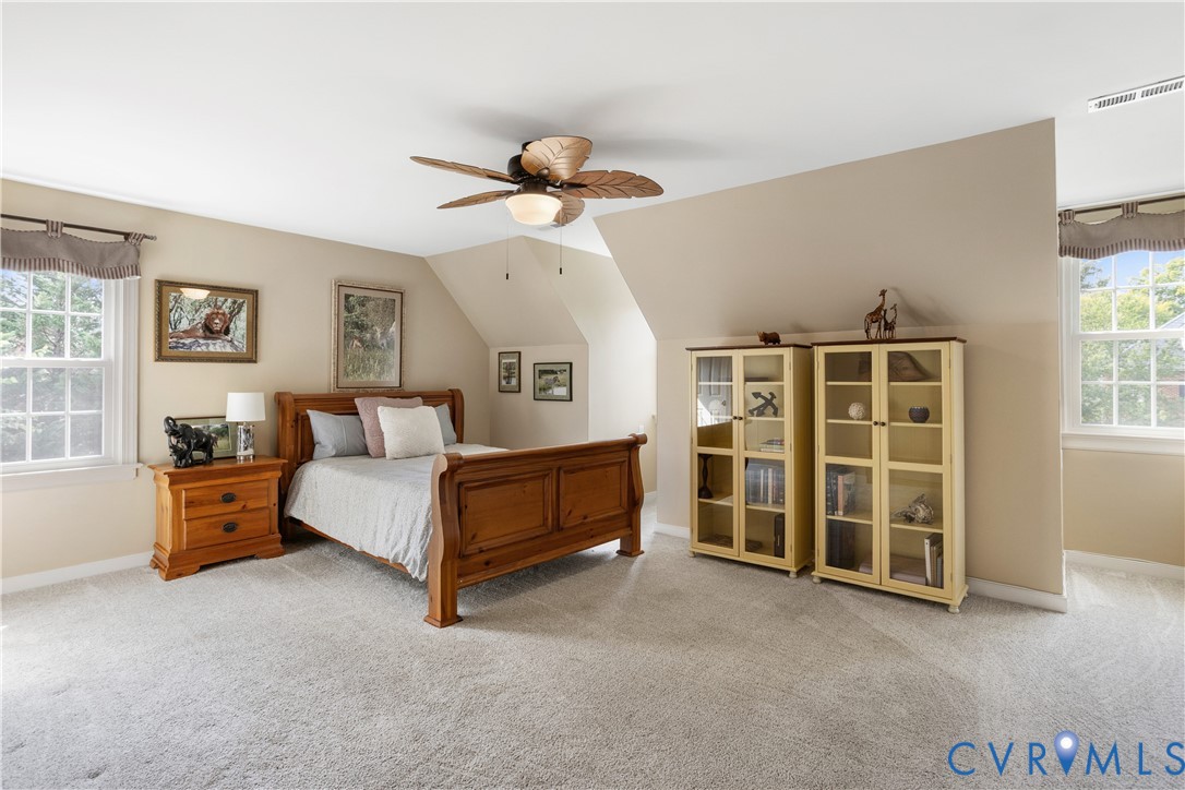 407 Lynchell Place Henrico, VA 23238 - Photo 38 of 50 a spacious bedroom with a bed and a window