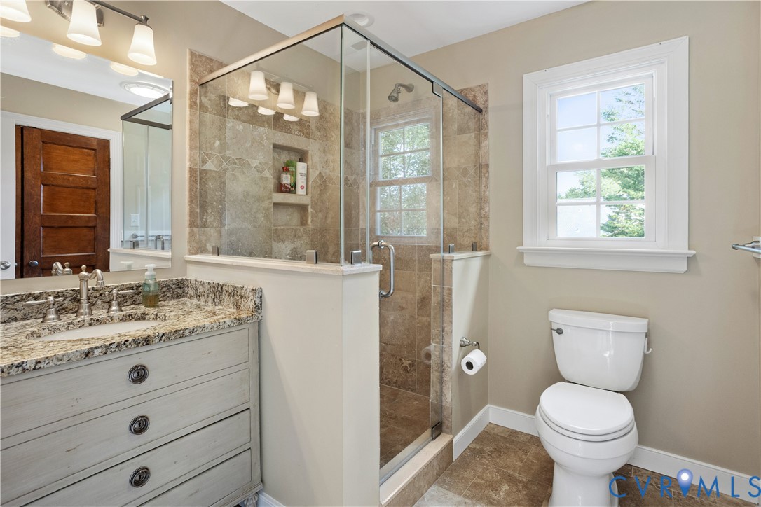 407 Lynchell Place Henrico, VA 23238 - Photo 41 of 50 a bathroom with a granite countertop toilet sink and a shower