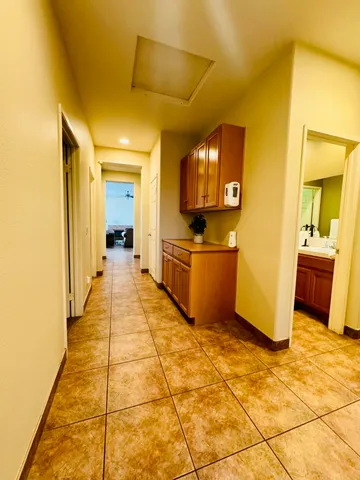 a utility room with sink dryer and washer