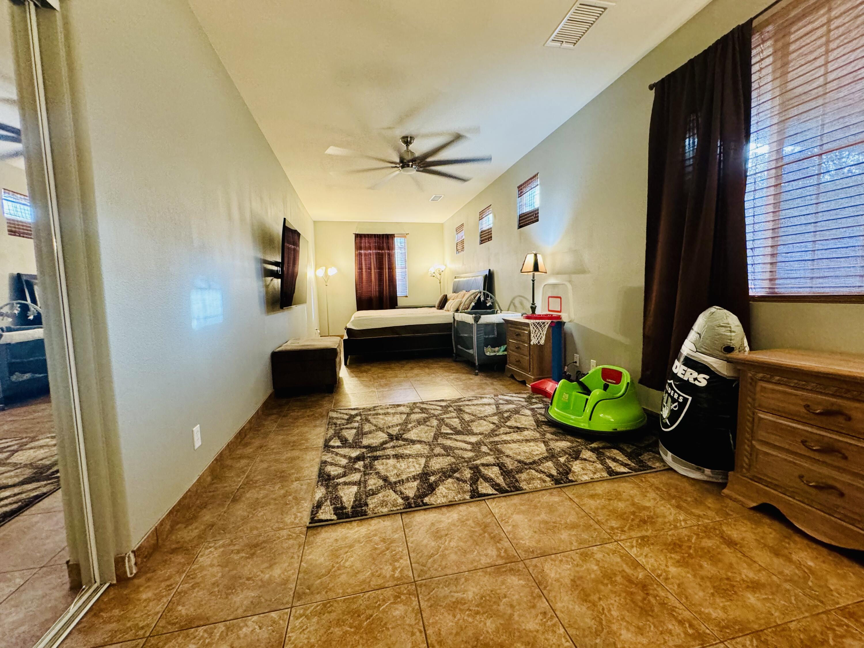 47398 Manteca Court Indio, CA 92201 - Photo 17 of 25 a living room with furniture and a rug