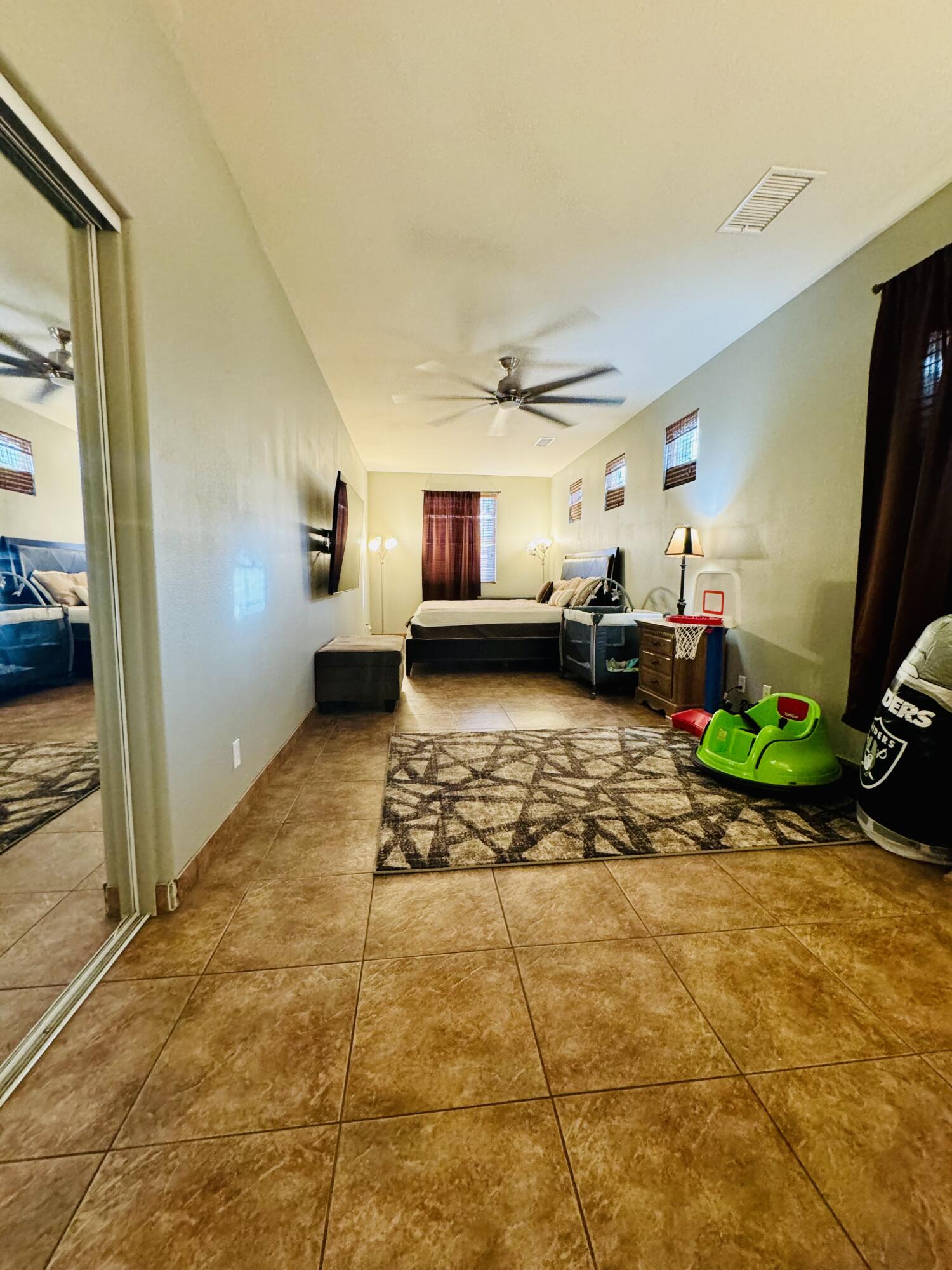 47398 Manteca Court Indio, CA 92201 - Photo 18 of 25 a living room with patio furniture and a flat screen tv