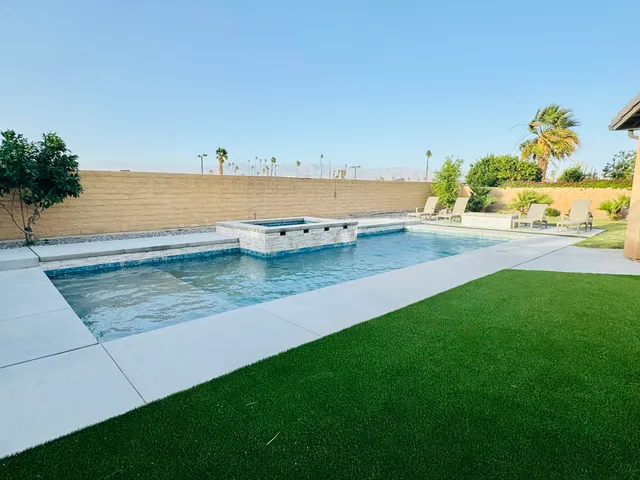 a view of a swimming pool and an ocean view