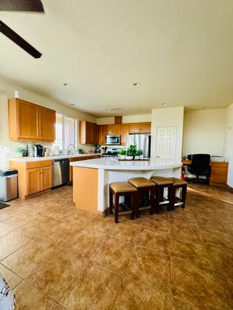 a kitchen with stainless steel appliances granite countertop a sink and cabinets