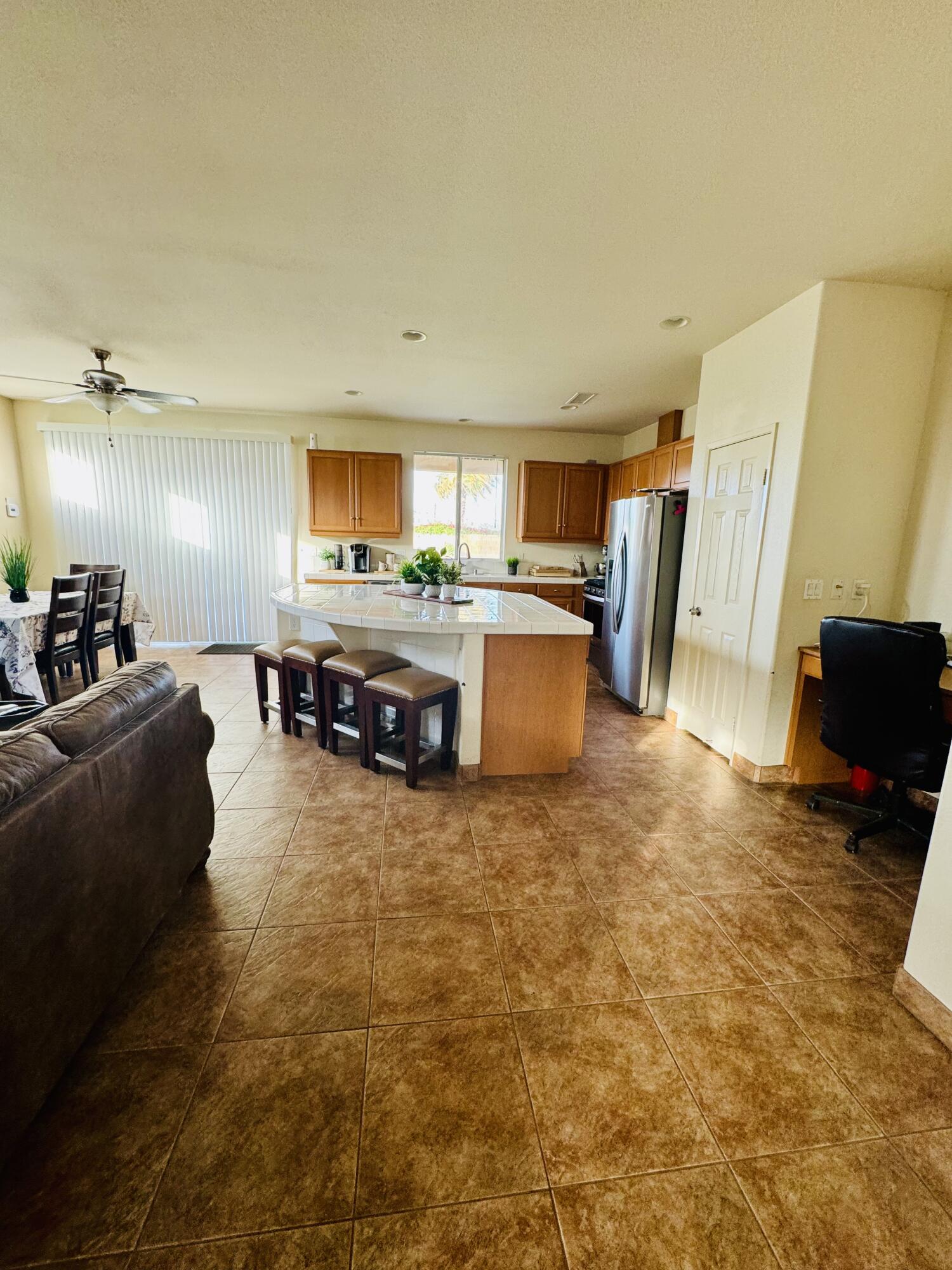 47398 Manteca Court Indio, CA 92201 - Photo 8 of 25 a living room with furniture and a flat screen tv