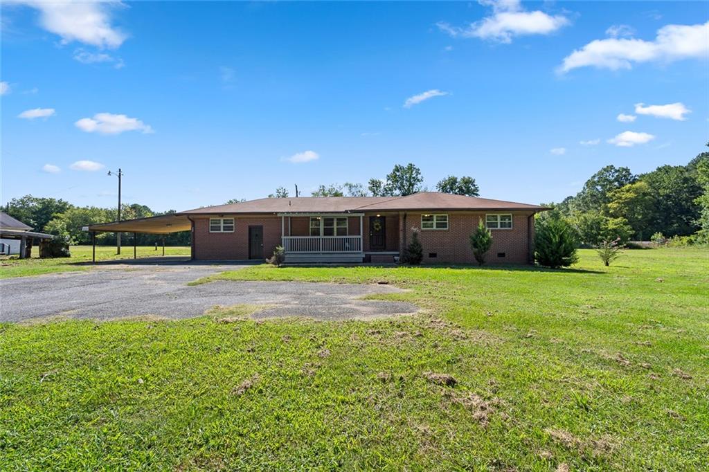 473 Pinson Road Northeast Rome, GA 30161 - Photo 1 of 1 a front view of house with yard and entertaining space