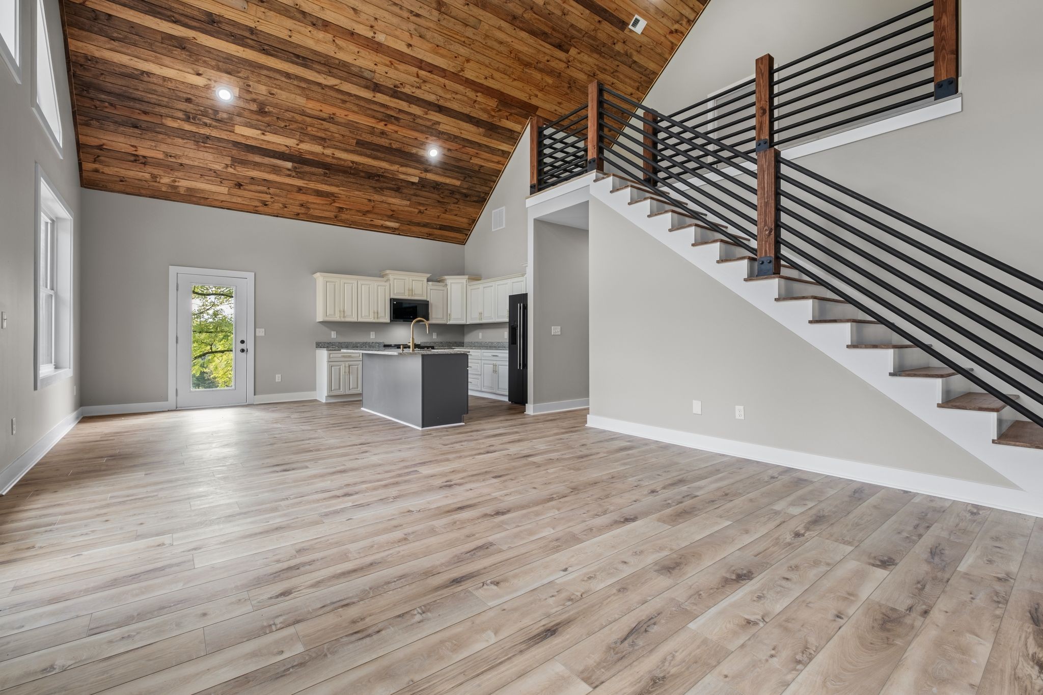 672 Sullivan Bend Road Elmwood, TN 38560 - Photo 13 of 39 a view of a kitchen with a sink and dishwasher with wooden floor