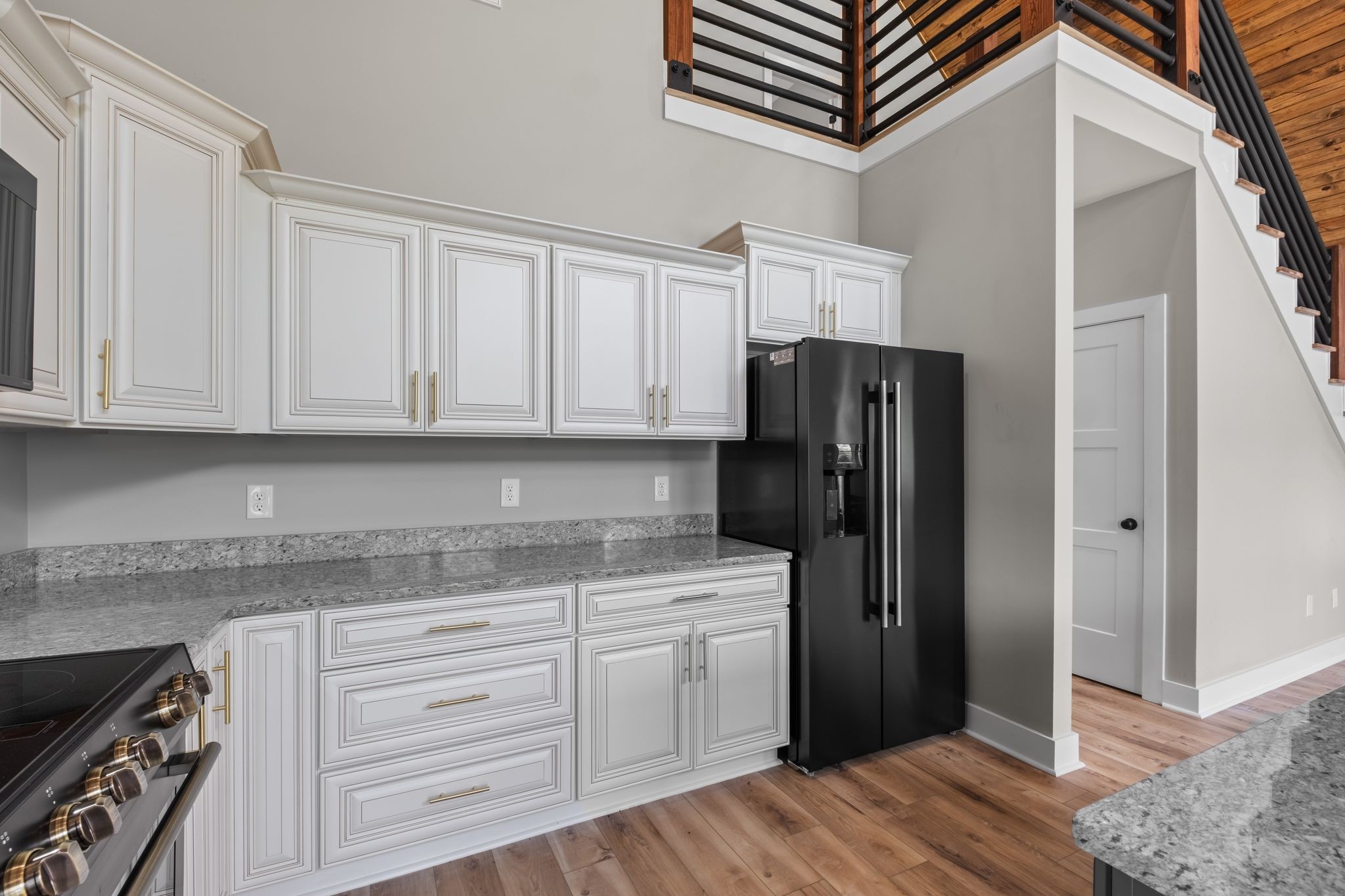 672 Sullivan Bend Road Elmwood, TN 38560 - Photo 19 of 39 a kitchen with granite countertop a refrigerator and a stove top oven