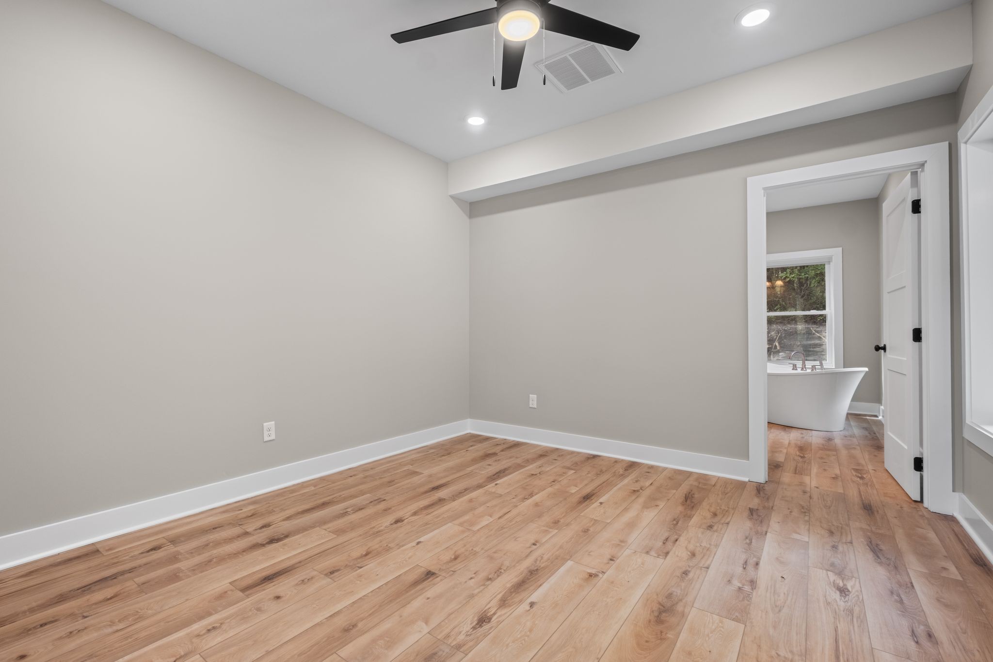 672 Sullivan Bend Road Elmwood, TN 38560 - Photo 21 of 39 wooden floor in an empty room with a window
