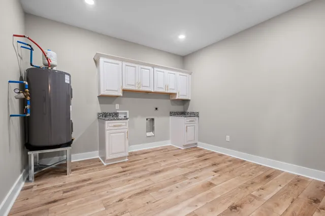 a view of cabinets and wooden floor