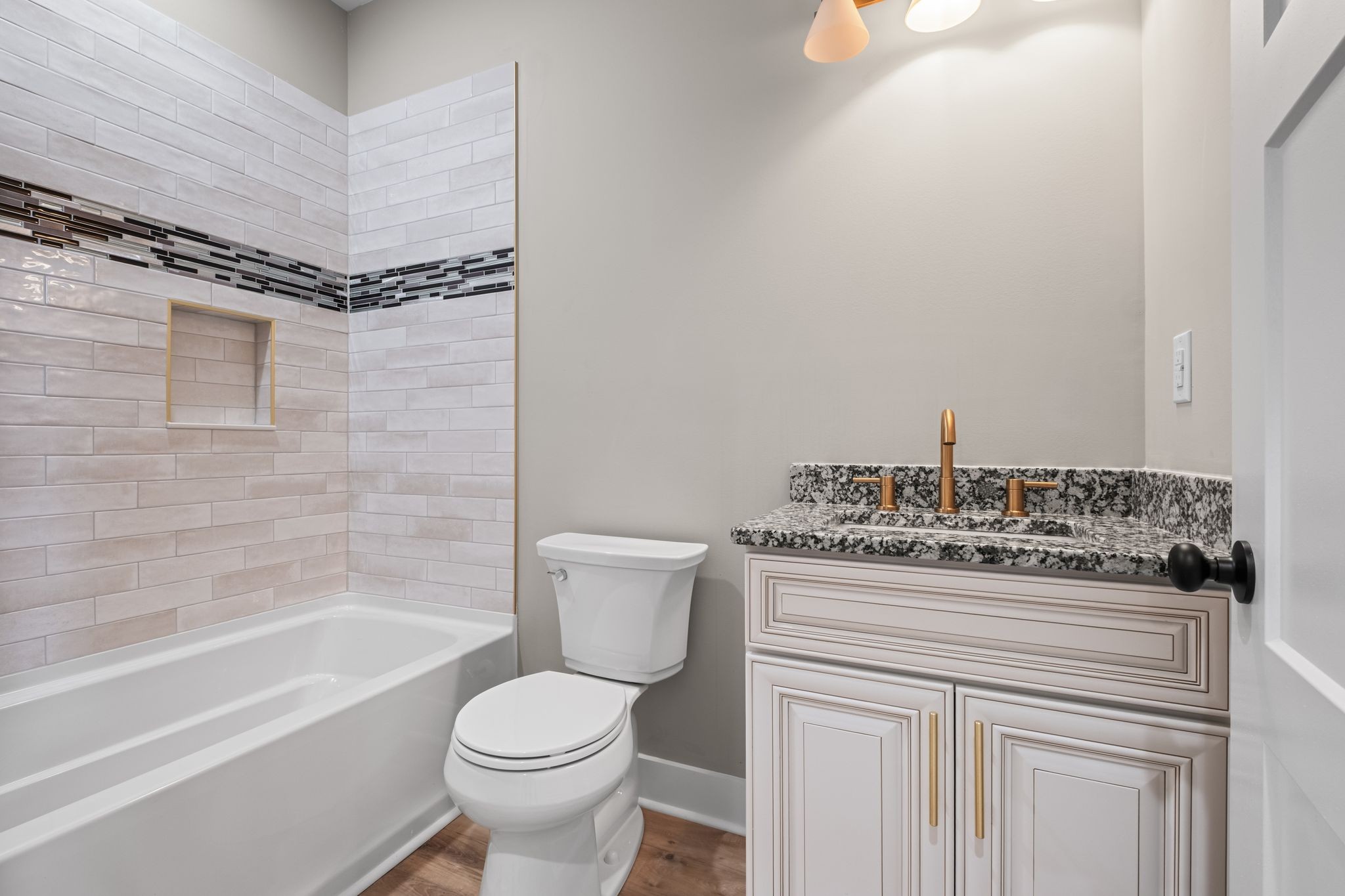672 Sullivan Bend Road Elmwood, TN 38560 - Photo 28 of 39 a bathroom with a granite countertop toilet sink and shower