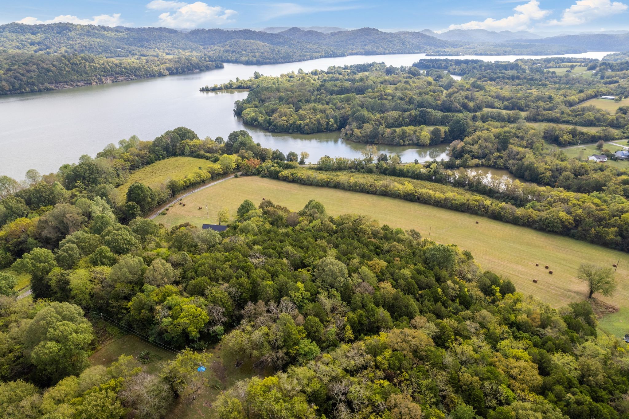 672 Sullivan Bend Road Elmwood, TN 38560 - Photo 35 of 39 a view of a lake with a mountain
