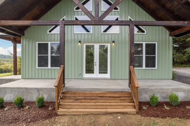 a front view of a house with a porch