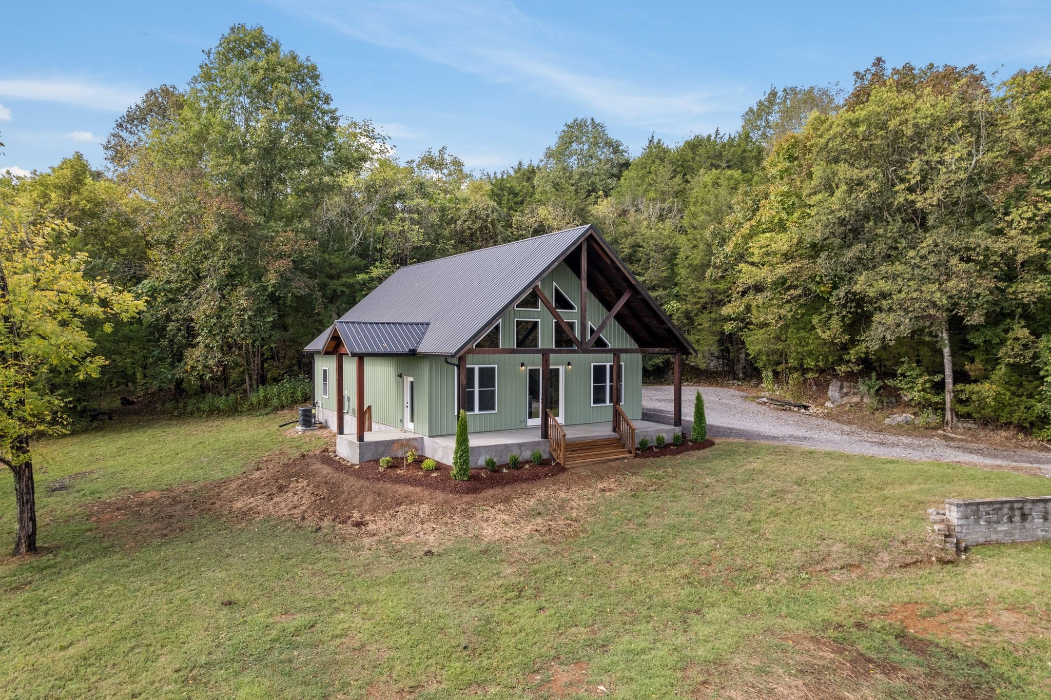 672 Sullivan Bend Road Elmwood, TN 38560 - Photo 6 of 39 a front view of a house with a yard