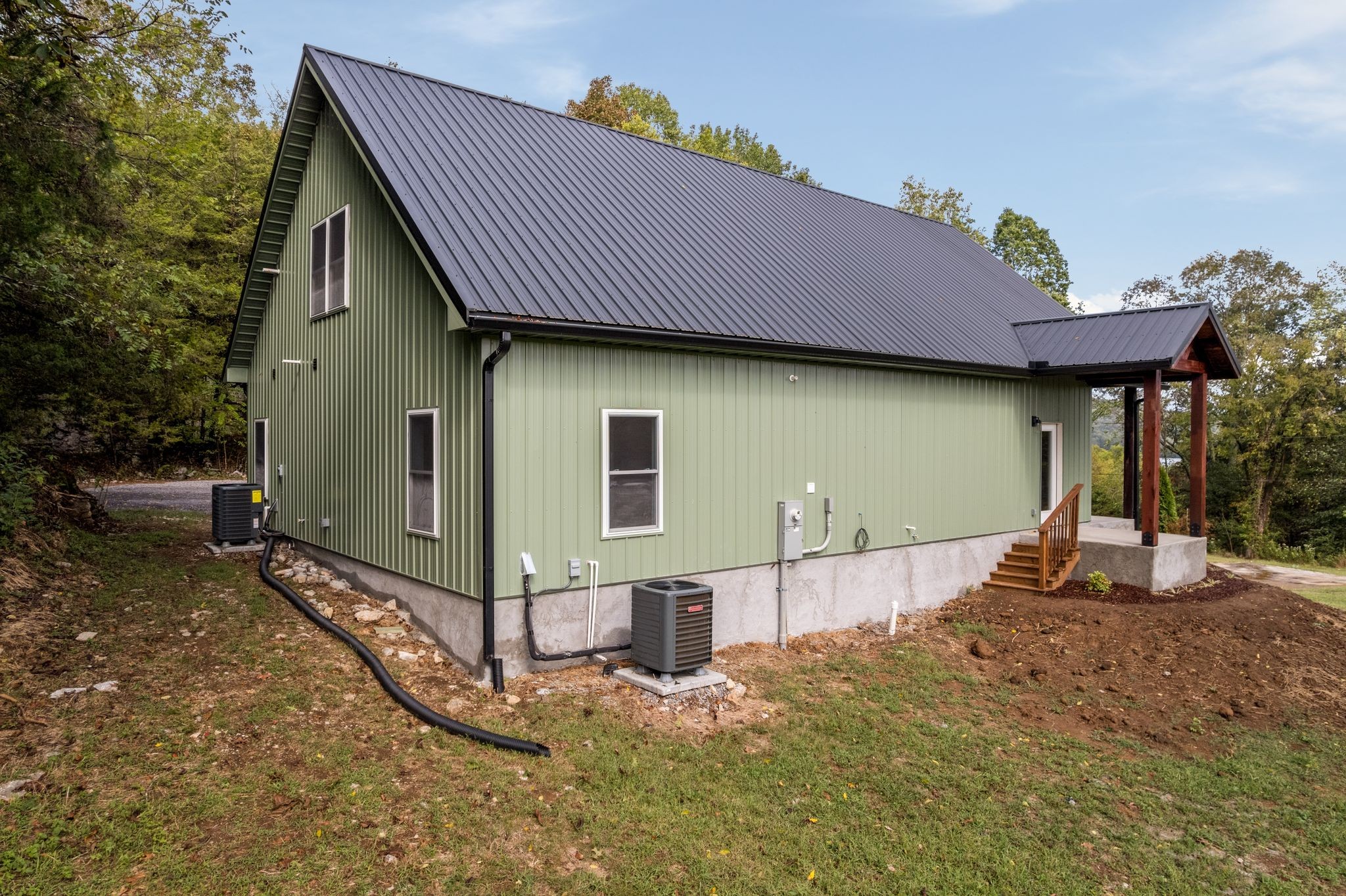 672 Sullivan Bend Road Elmwood, TN 38560 - Photo 9 of 39 a front view of a house with garden