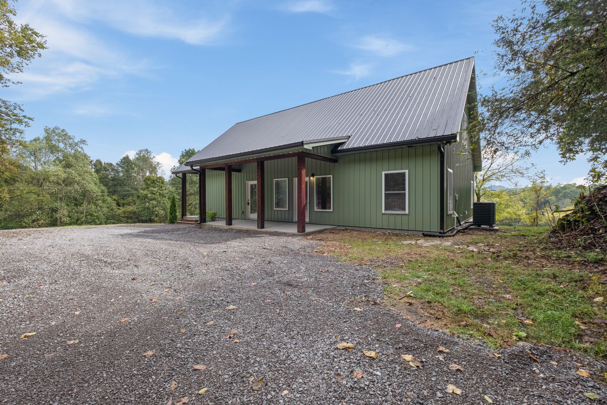 672 Sullivan Bend Road Elmwood, TN 38560 - Photo 10 of 39 a view of a house with backyard and trees