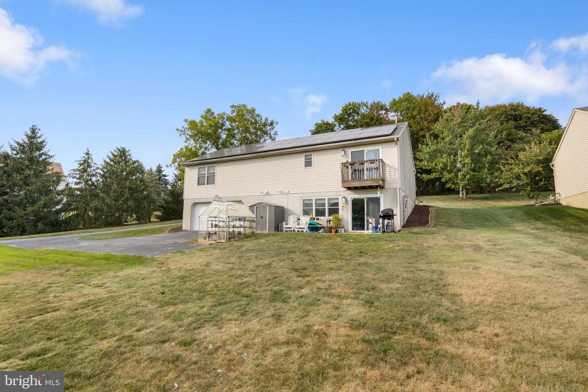 840 Country Club Road Red Lion, PA 17356 - Photo 34 of 39 Charming hillside retreat with lush greenery.