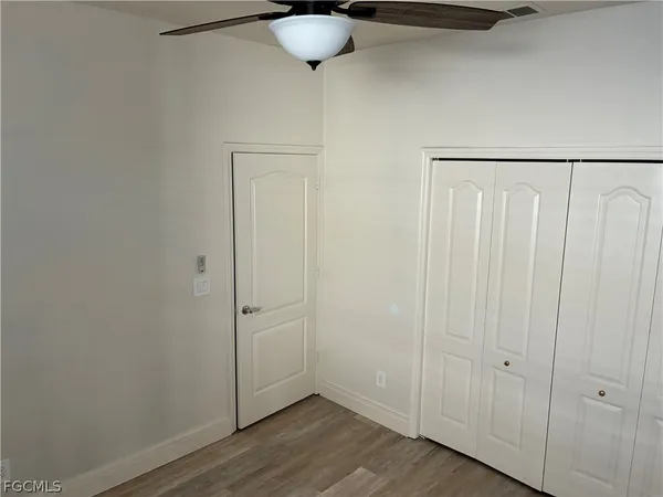a view of a livingroom with wooden floor