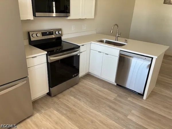 a kitchen with wooden cabinets and a stove top oven