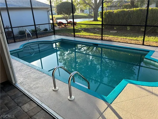 a view of swimming pool with a patio