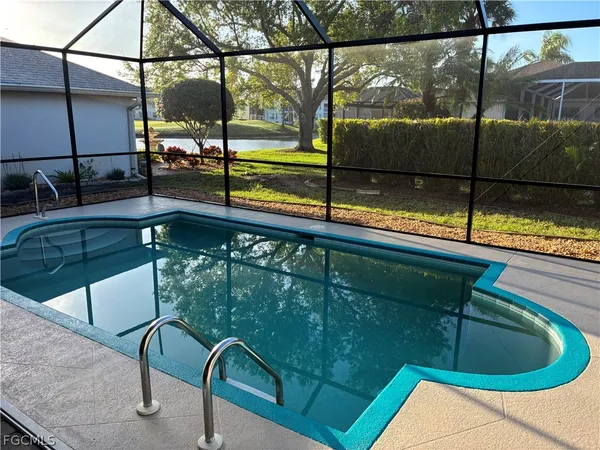 a view of swimming pool from a balcony