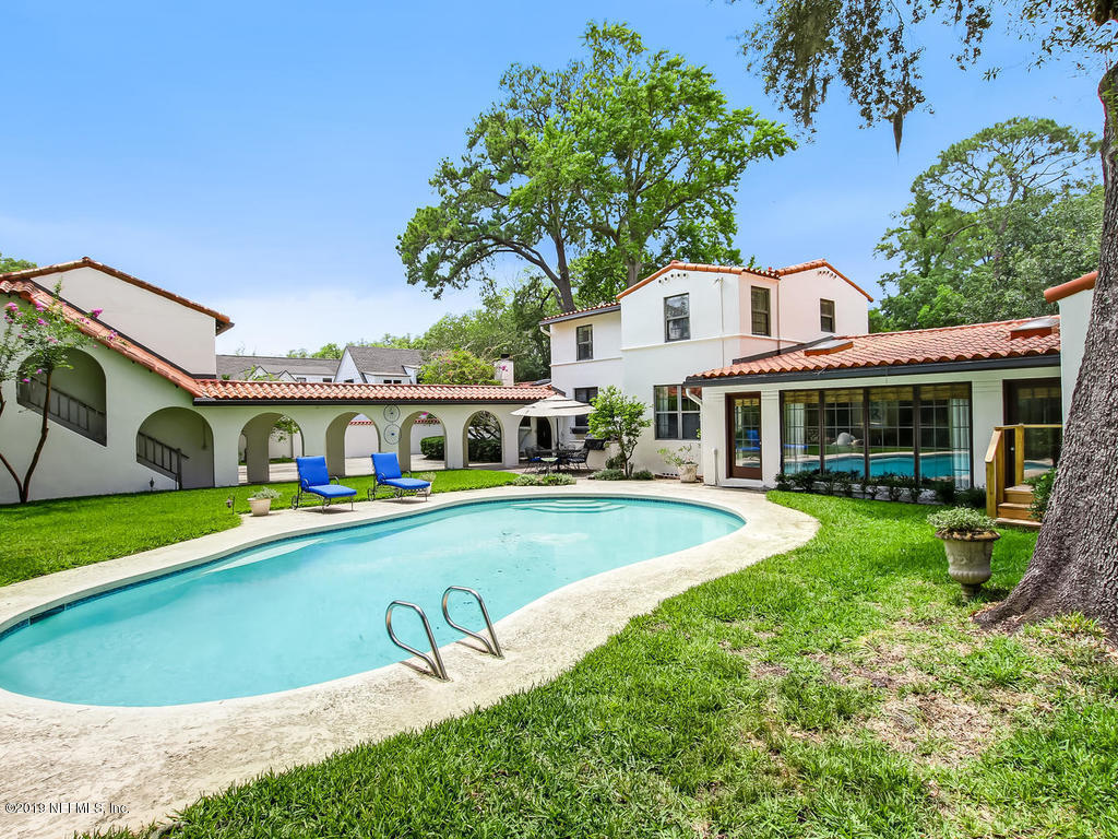 1036 Elder Lane Jacksonville, FL 32207 - Photo 14 of 79 a front view of a house with swimming pool having outdoor seating