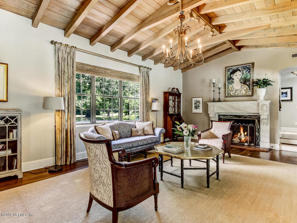 1036 Elder Lane Jacksonville, FL 32207 - Photo 17 of 79 a living room with furniture a fireplace and a table
