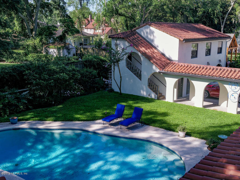 1036 Elder Lane Jacksonville, FL 32207 - Photo 2 of 79 a front view of a house with a yard
