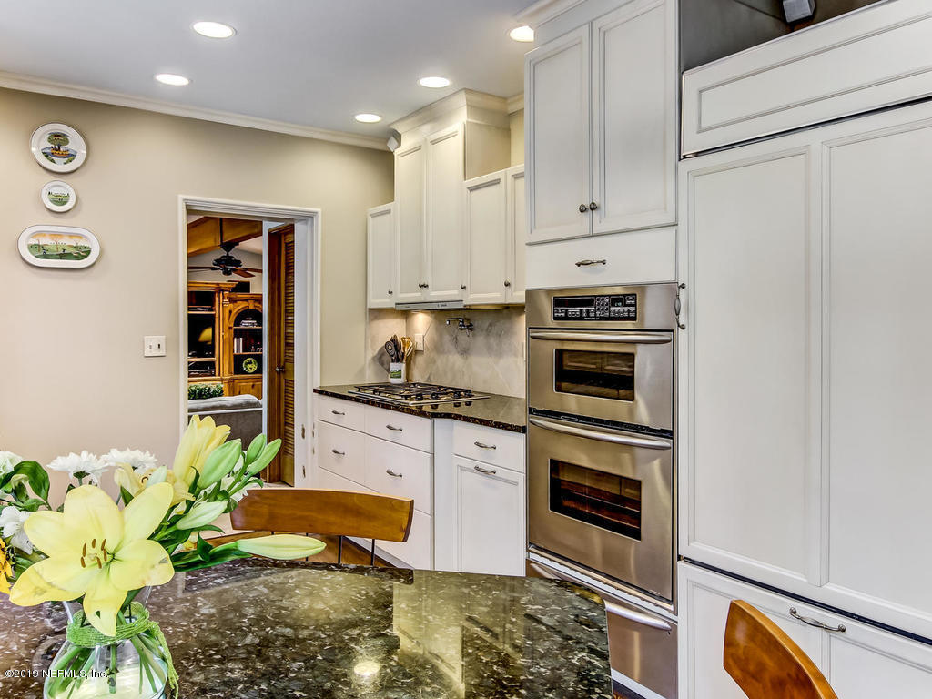 1036 Elder Lane Jacksonville, FL 32207 - Photo 23 of 79 a kitchen with stainless steel appliances granite countertop a stove a sink and a refrigerator