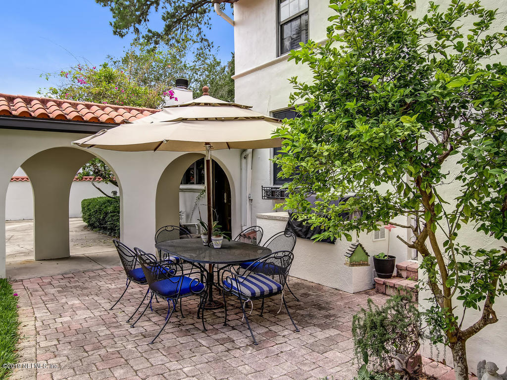 1036 Elder Lane Jacksonville, FL 32207 - Photo 31 of 79 a view of a chairs and table in the patio