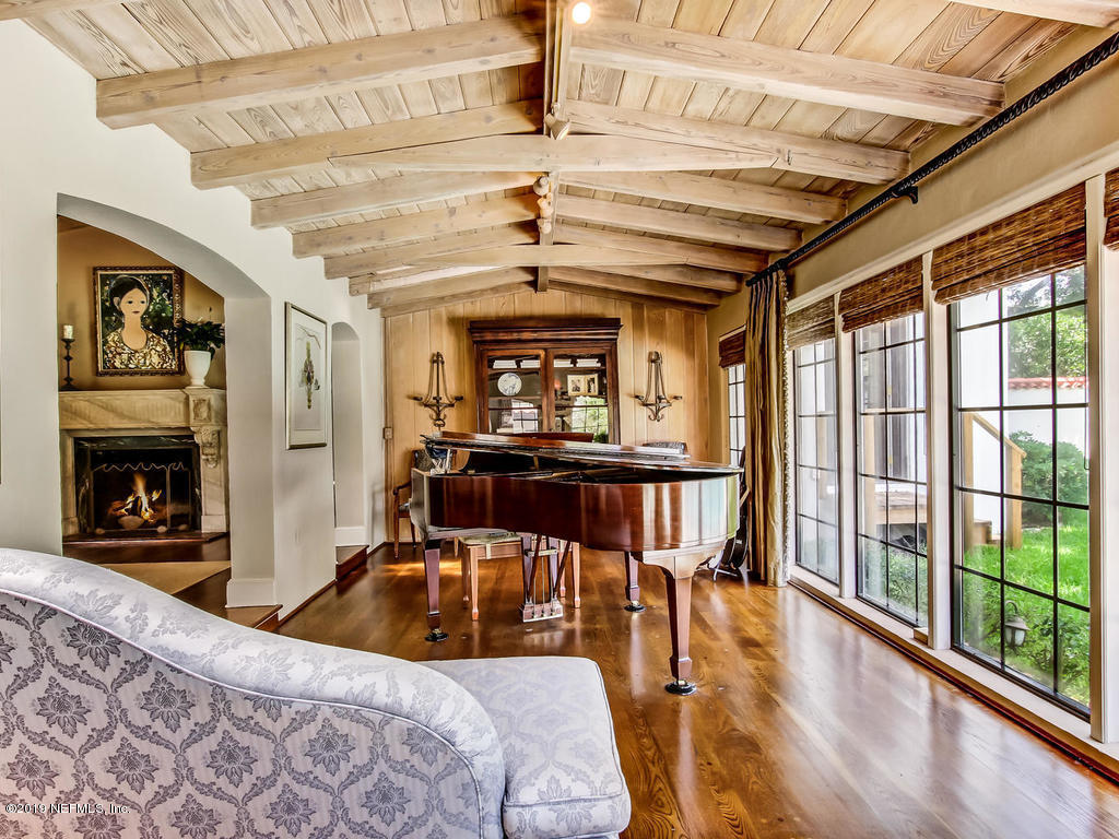 1036 Elder Lane Jacksonville, FL 32207 - Photo 33 of 79 a bedroom with furniture and a large window