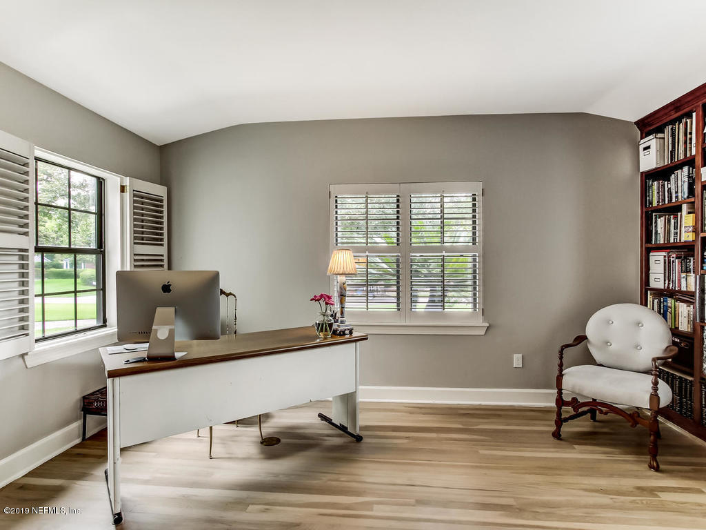 1036 Elder Lane Jacksonville, FL 32207 - Photo 53 of 79 a room with a window and a lounge chair