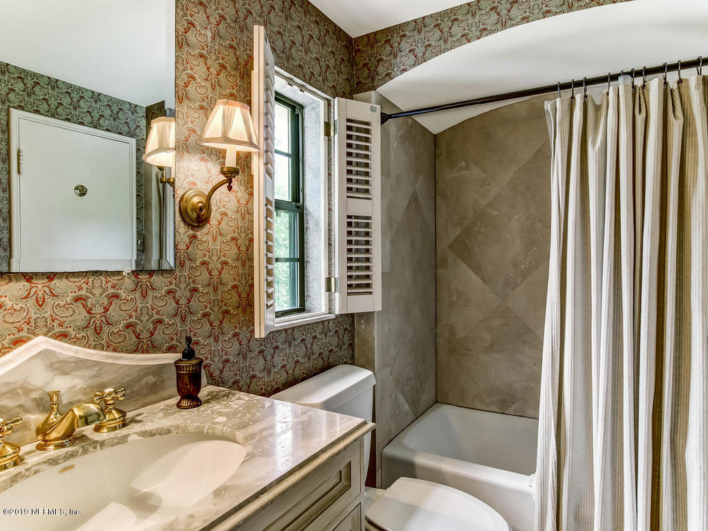 1036 Elder Lane Jacksonville, FL 32207 - Photo 59 of 79 a bathroom with a sink toilet and shower