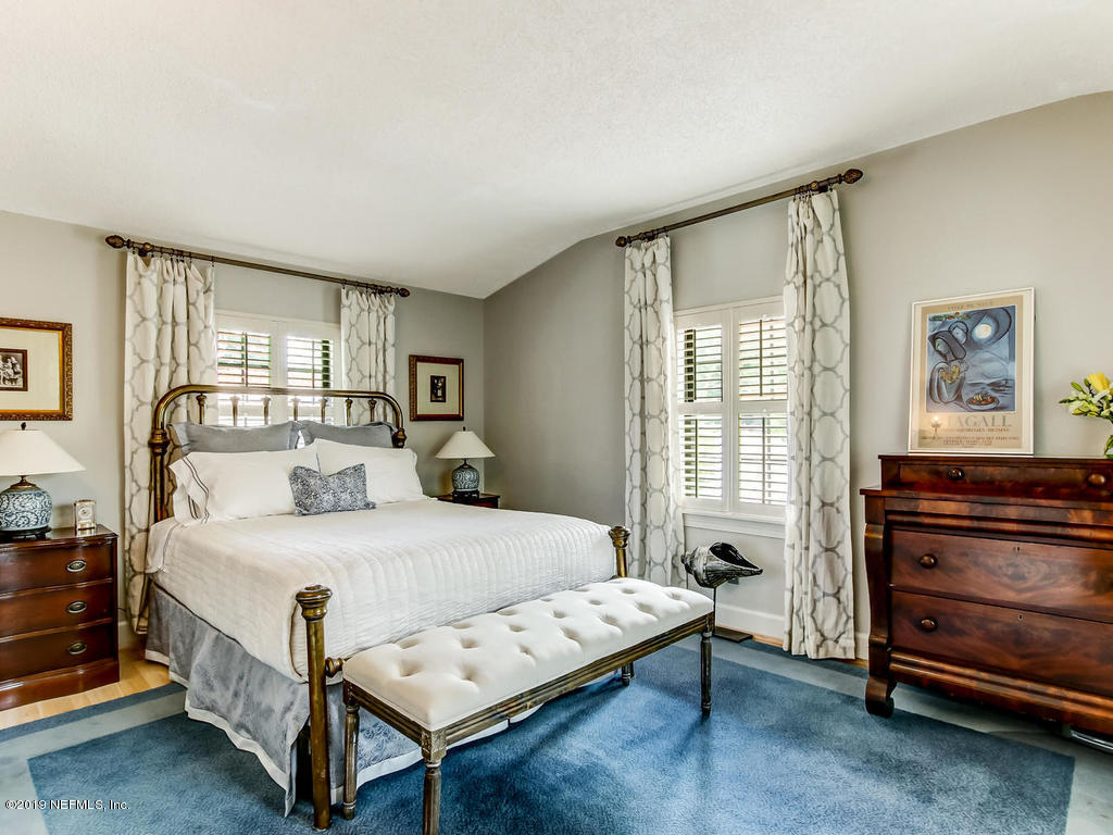 1036 Elder Lane Jacksonville, FL 32207 - Photo 61 of 79 a bedroom with a bed and a window