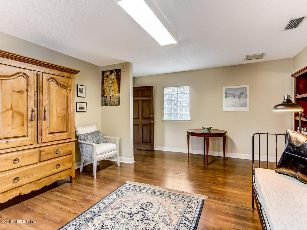 1036 Elder Lane Jacksonville, FL 32207 - Photo 66 of 79 a living room with furniture and a wooden floor